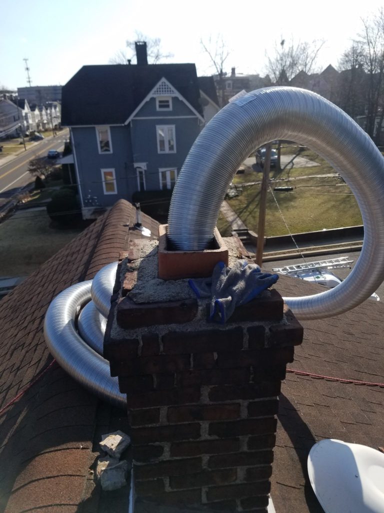 relining masonry chimney for a gas furnace, midtown chimney sweeps