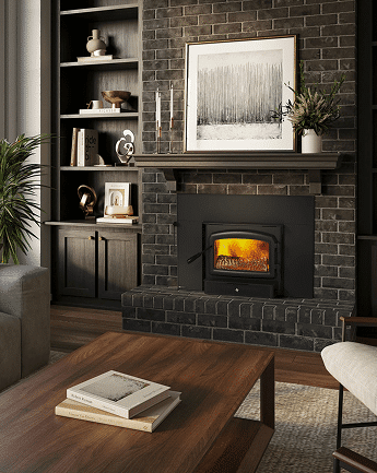 A black wood-burning stove set into a dark brick fireplace, with built-in shelves and a framed landscape print on the wall above.