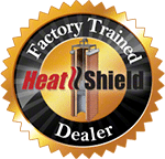 A HeatShield Dealer logo with a gold gear-shaped border, black circular center, and factory-themed iconography on a transparent background.