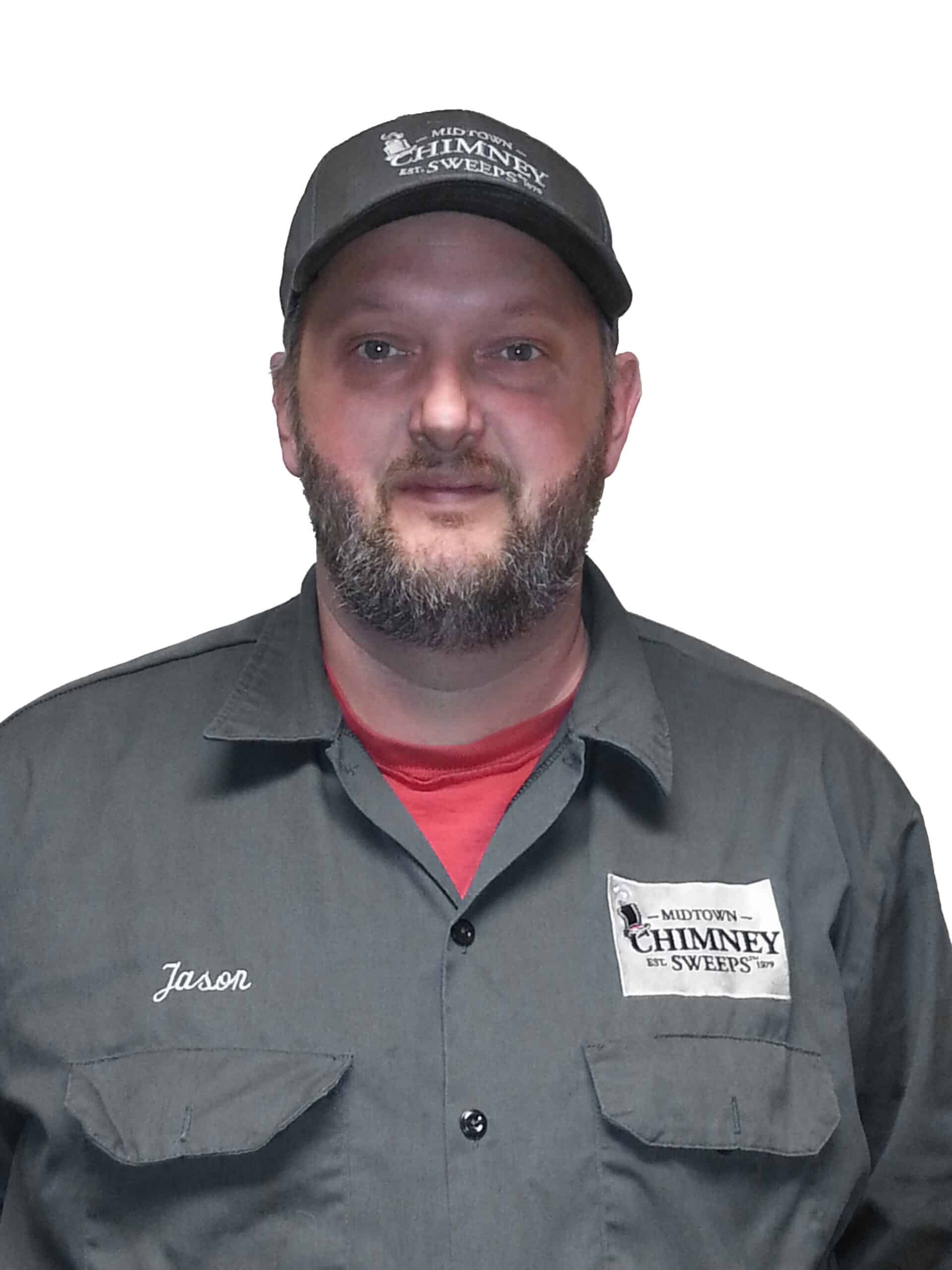 A man wearing a black Chimney Sweeps cap and gray work shirt with his name embroidered on the chest, photographed against a plain white background.